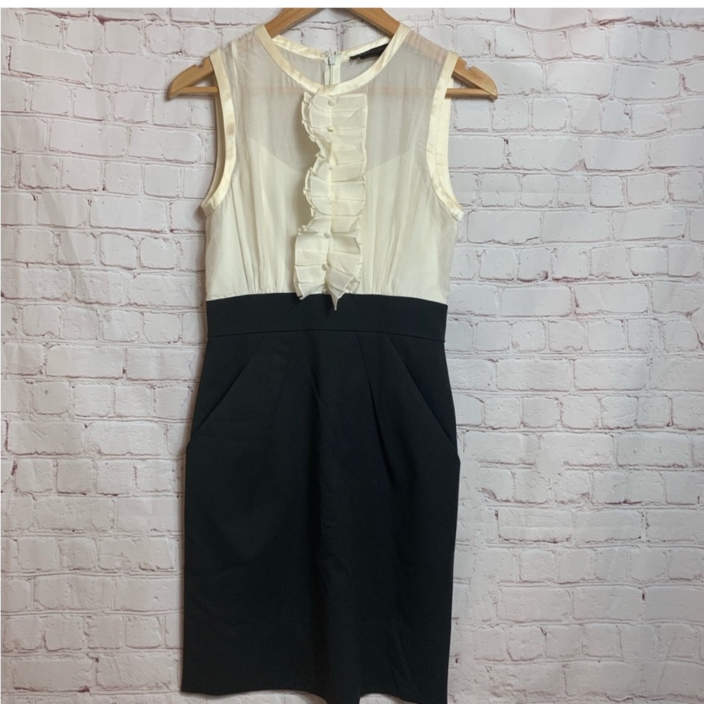 BCBG Max Azaria cream and black silk blend dress. Ruffled with buttons